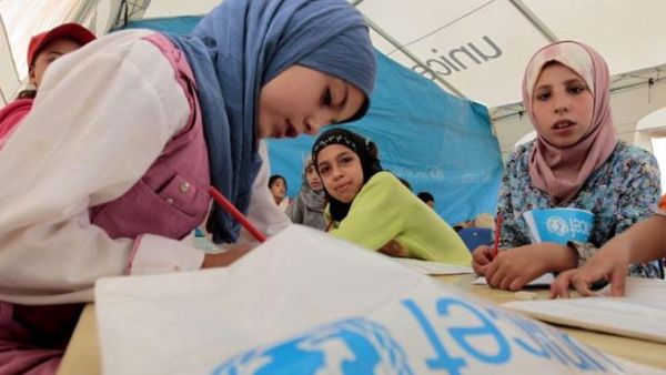 Young Syrian refugees attend a UNICEF-run school at the al-Zaatari refugee camp in the Jordanian city of Mafraq. (AFP/ Khalil Mazraawi)