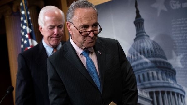 Sen. John Cornyn (R-TX) and Sen. Chuck Schumer (D-NY) exit a news conference concerning the Justice Against Sponsors of Terrorism Act (JASTA), on Capitol Hill, May 17, 2016, in Washington, DC. (AFP/Getty Images/Drew Angerer)