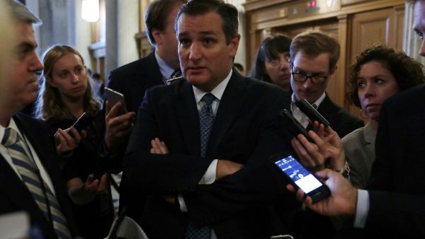 US Sen. Ted Cruz speaks to members of the media at the Capitol September 28, 2016 in Washington, DC after the Senate voted to override President Obama's veto of a bill allowing families of 9/11 victims to sue the Saudi government. (AFP/Alex Wong)