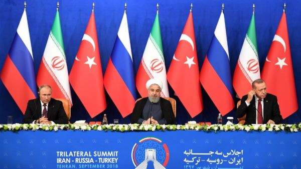 Iranian President Hassan Rouhani (C), Turkish President Recep Tayyip Erdogan (R) and Russian President Vladimir Putin attend a press conference after a trilateral meeting in Tehran on September 7, 2018.(Kirill KUDRYAVTSEV / POOL / AFP)
