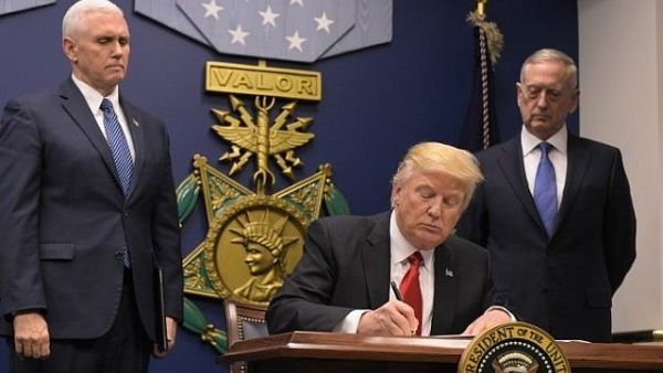 US President Donald Trump signing an executive order at the Pentagon.  (AFP Photo/Mandel Ngan)