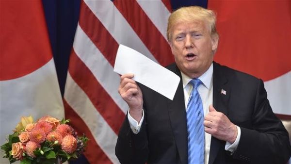 US President Donald Trump shows a letter he said he received the previous day from North Korean leader Kim Jong-un, on September 26, 2018. (AFP/File)