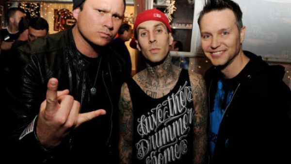 Former Blink-182 guitarist Tom DeLonge has hinted he could be set to return to the band after holding talks with drummer Travis Barker. /AFP Former Blink-182 guitarist Tom DeLonge has hinted he could be set to return to the band after holding talks with drummer Travis Barker. /AFP