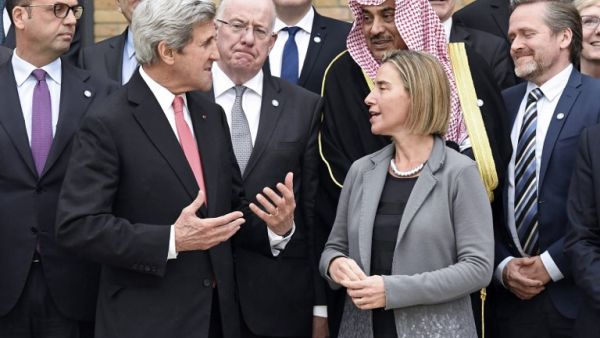 US Secretary of State John Kerry speaks to other conference delegates (Bertrand Guay/Pool/AFP)