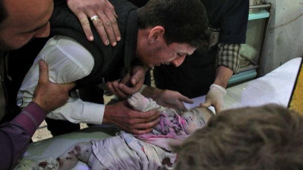 A Syrian cries over body of a lifeless baby on November 2, 2017 in the Eastern Ghouta region outside Damascus. (AFP/ File Photo)