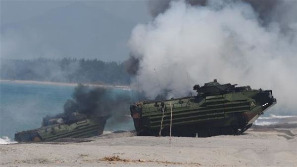 Amphibious Assault Vehicles (AAV) of the US marines emit white smoke during an amphibious landing exercise at the beach of the Philippine. (AFP/File)