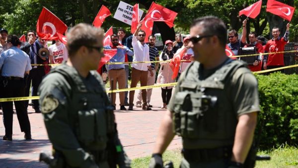 Pro-Erdogan supporters wave Turkish flags during a rally in front of the White House in Washington,DC on May 16, 2017. (AFP/Olivier Douliery)
