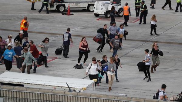 Travelers are evacuated out of the terminal and onto the tarmac after airport shooting at Fort Lauderdale in Florida. (AFP/File)