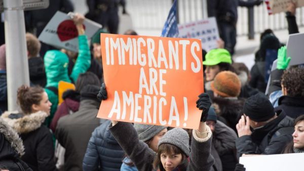 Protesters gather at JFK International Airport's Terminal 4 to demonstrate against President Donald Trump's executive order in New York. (AFP)