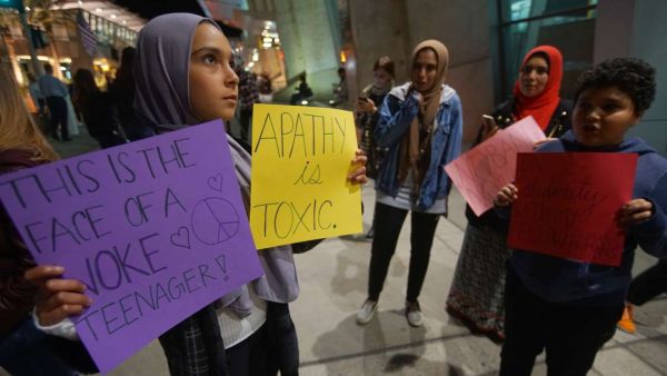 A group of Muslim protesters gather during a rally against the travel ban at San Diego International Airport. (AFP)