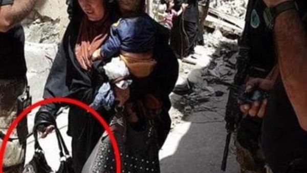 The woman in this photo reportedly blew herself up moments later (al-Mawsleya)