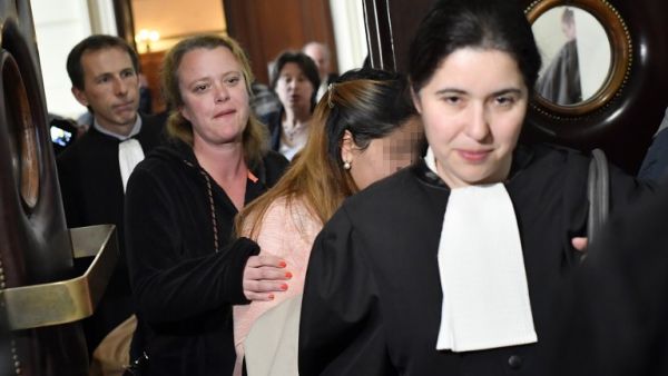 One of the victims (2ndR) arrives to attend the so-called "Conrad princesses" trial in front of the Brussels criminal court for human trafficking, on May 11, 2017. (AFP/Dirk Waem)