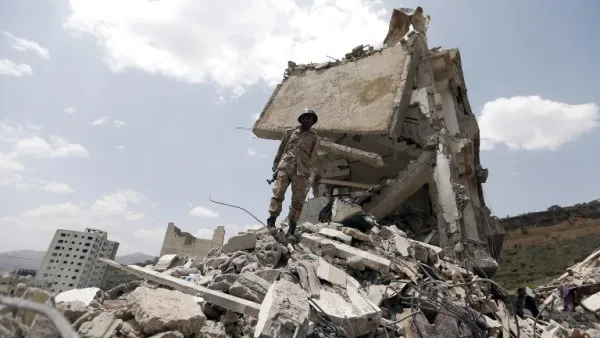 A building destroyed after a Saudi-led airstrike on Yemen's capital Sanaa (AFP)