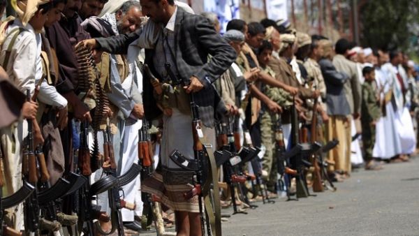 Houthi fighters parade with their weapons in Sanaa last month (AFP/file photo)