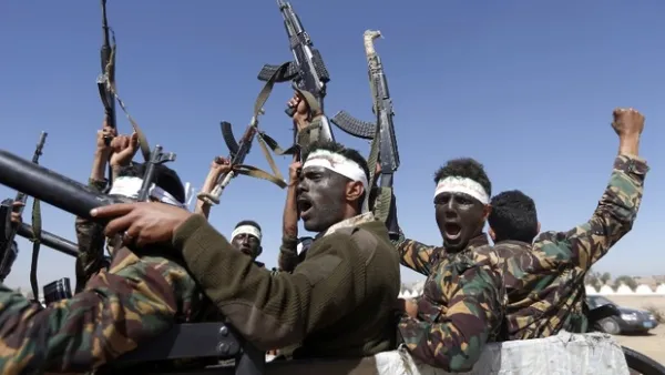 Houthi fighters chant slogans as they ride through Yemen's capital Sanaa. (AFP/file photo)