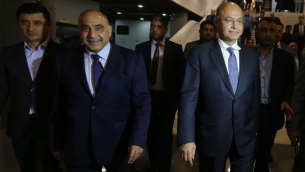 Adel Abdul Mahdi (2nd L) and Barham Saleh (2nd R) left the parliament chamber together. (AFP/File)