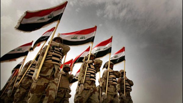 Iraqi army recruits parade during a graduation ceremony near Baghdad. [Getty Images]