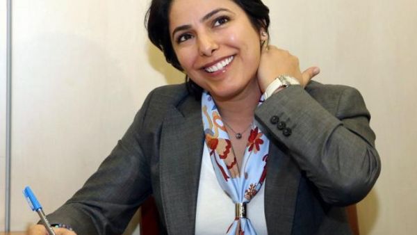 Kuwaiti candidate Reham al-Jlewe registers for the upcoming parliamentary election in Kuwait City (AFP)