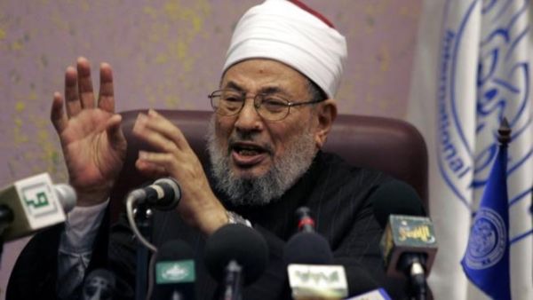 The well-known cleric faces trial in absentia in Egypt over charges of  "agreement, incitement and assistance to commit intentional murder, helping prisoners to escape, arson, vandalism and theft," according to Interpol. (AFP/File)