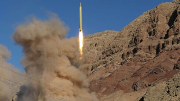  Iran launches a medium-range ballistic missile in the Alborz mountains (AFP/File Photo)