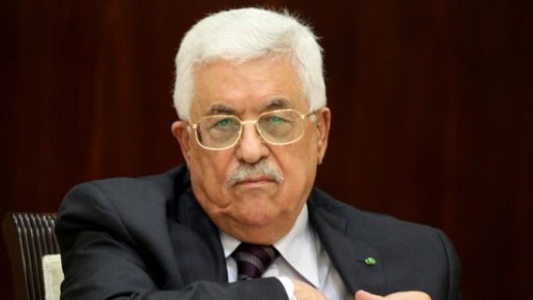 The PA, headed by Mahmoud Abbas will return to Gaza in December (AFP)
