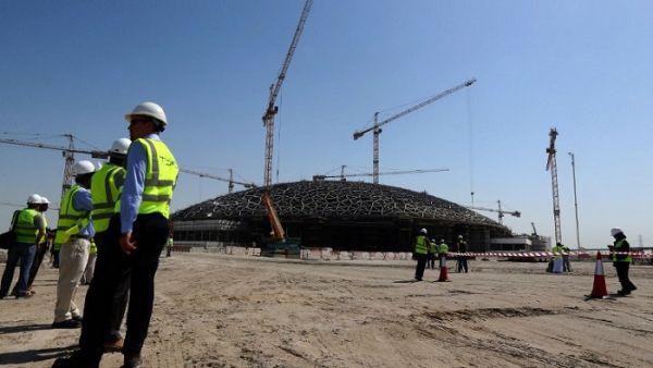 Abu Dhabi's effective policy response to low oil prices and economic growth were key drivers of Moody's outlook change. (AFP/ Marwan Naamani)