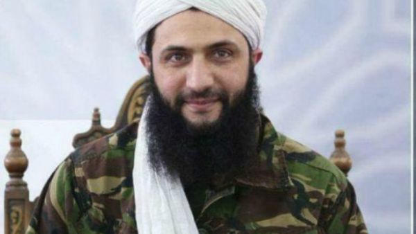 Russia's defense ministry said that the former al-Nusra Front leader lost an arm and is in a "critical condition" following the strike that also killed 12 Hayat Tahrir al-Sham commanders, including Jolani's security chief (AFP/File Photo)