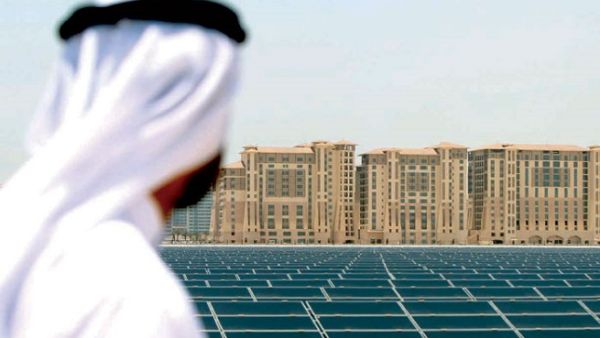 An Emirati man looks at the solar power platform at Masdar City, on the outskirts of Abu Dhabi. (AFP)