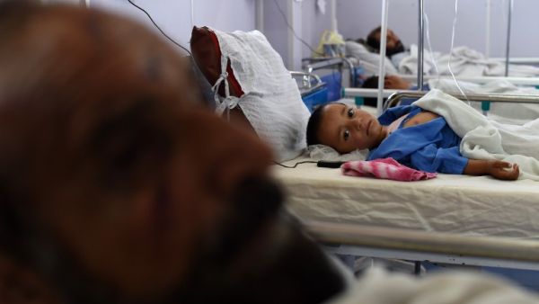 In this photograph taken on May 21, 2015, an Afghan child receives treatment at the Medecins Sans Frontieres (MSF), or Doctors Without Borders, hospital in the northern city of Kunduz. (AFP/Shah Marai)