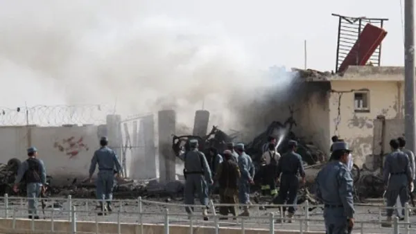 Afghan police inspect a suicide car bombing of the police chief's office in Lashkar Gah in Helmand province. Image used for illustrative purposes. (AFP/File)