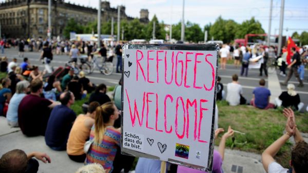 A sign reading "Refugees Welcome" is seen in Germany. Several German states have banned fireworks to avoid further traumatizing refugees. (AFP/File)