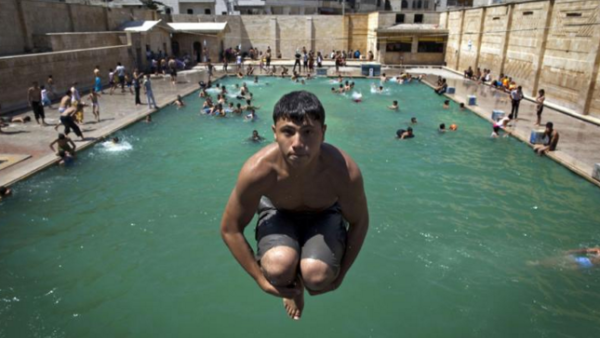 Men, women, children and even the elderly are taking swimming lessons at Jordanian sports clubs. Photo of Syrian child swimming in Aleppo. (AFP/File)