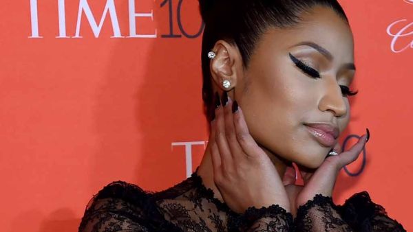 The 35-year-old Anaconda rapper appears to completely disrobe for the first portion of the video. (AFP/File)