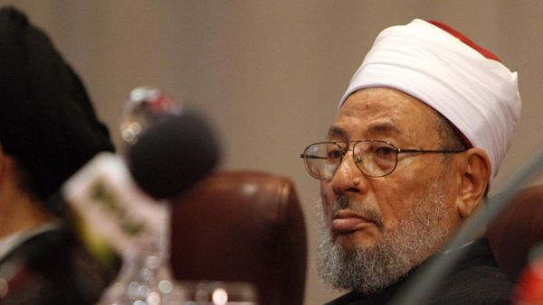 The global police agency issued arrest warrant for Yousef al-Qaradawi in 2014 at request of Egypt’s post-coup regime. (AFP/File)