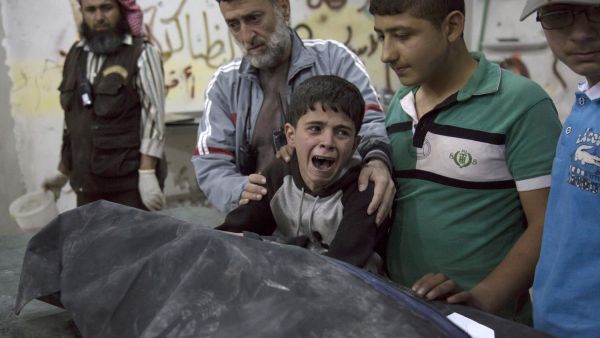 A Syrian boy crying after the loss his family (AFP/File Photo)	