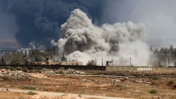 Smoke rises from a Syrian regime airstrike on rebel positions inside Aleppo. (AFP/George Orfalian)