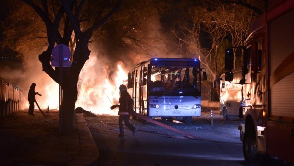 Firefighters try to extinguish flames following an explosion after an attack targeted a convoy of military service vehicles in Ankara on February 17, 2016. (AFP/Stringer)