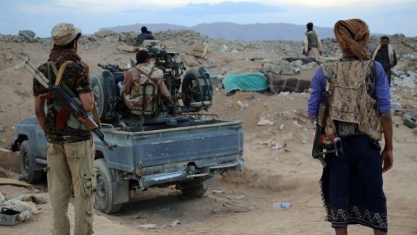 Armed Yemeni tribesmen from the Popular Resistance Committees, supporting forces loyal to Yemen's exiled government, monitor the area east of Sanaa following clashes with Shiite Houthi rebels on Sept. 12, 2015. (AFP/Abdullah Hassan)