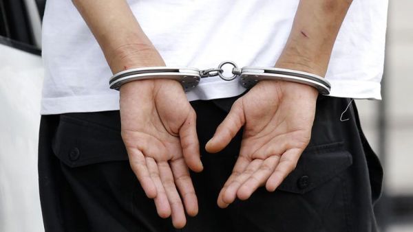 Hands in handcuffs (AFP/File Photo)