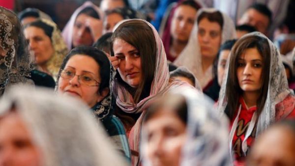 Assyrian Christian women attend church in Jdeideh, Lebanon on March 8, 2015 after fleeing bloodshed in neighboring Syria.  (AFP/File)