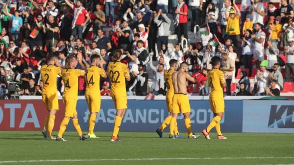 Australia's players celebrate after winning the 2019 AFC Asian Cup group B football match between Palestine and Australia at the Maktoum Bin Rashid Al-Maktoum Stadium in Dubai on January 11, 2019.
Karim Sahib / AFP