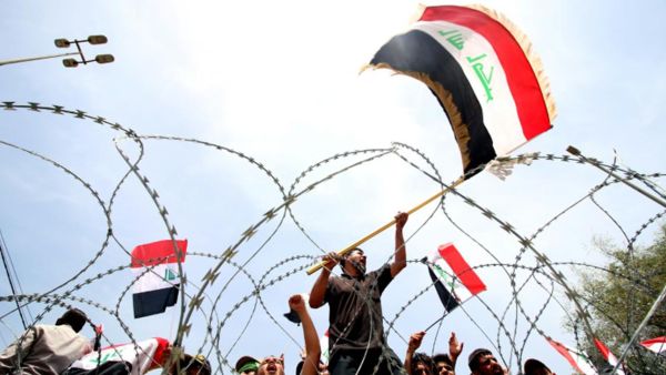 Supporters of Iraqi Shi'i cleric Muqtada al-Sadr storm demonstrate for government reform in late April 2016 outside Baghdad's 'Green Zone,' a tightly secured area of the capital city containing Parliament.  (AFP/File)