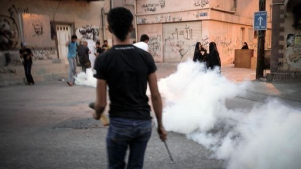Tear gas rises after police clash with Bahraini protesters in February 2014. (AFP/File)