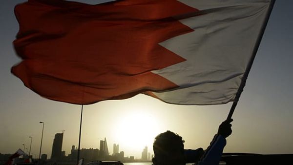 Man holding a flag of Bahrain (AFP/File Photo)	