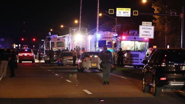 Law enforcement personnel work the scene at the Marjory Stoneman Douglas High School after a shooting at the school that killed 17 people on Feb. 14, 2018 in Parkland, Florida (AFP)