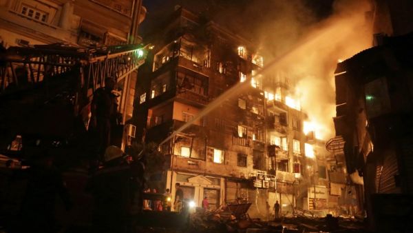 Firefighters fight a blaze in downtown Cairo on May, 9, 2016 - one of many fires in the city this week. (AFP/Ahmed Abd El-Gawad)