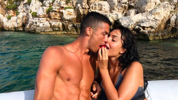 The loved-up couple were first seen strolling along the beach together (Source: georginagio / Instagram )