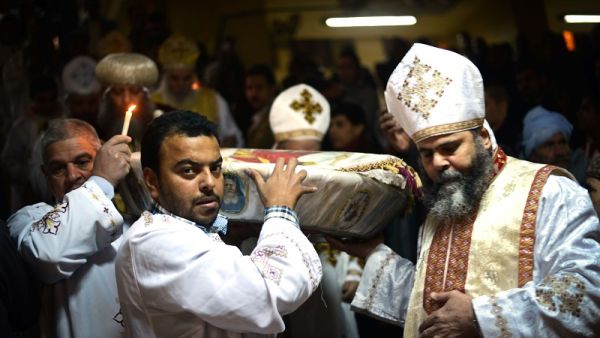Egyptian Coptic Christian religious leaders celebrate Christmas in the monastery of Saint Samaan in Cairo on Jan. 6, 2015 (AFP)