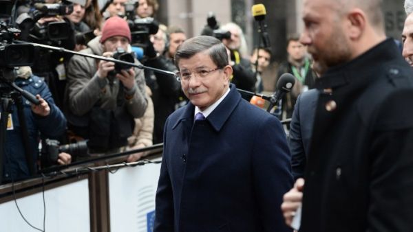 Turkish Prime Minister Ahmet Davutoglu arrives on the second day of the European Union summit to discuss the ongoing refugee crisis, in Brussels on March 18, 2016. (AFP/Stephane de Sakutin)