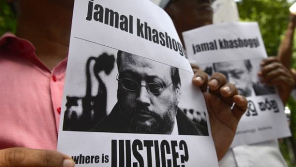 Sri Lankans hold images of slain journalist Jamal Khashoggi outside the Saudi embassy in Colombo (AFP/ File Photo)